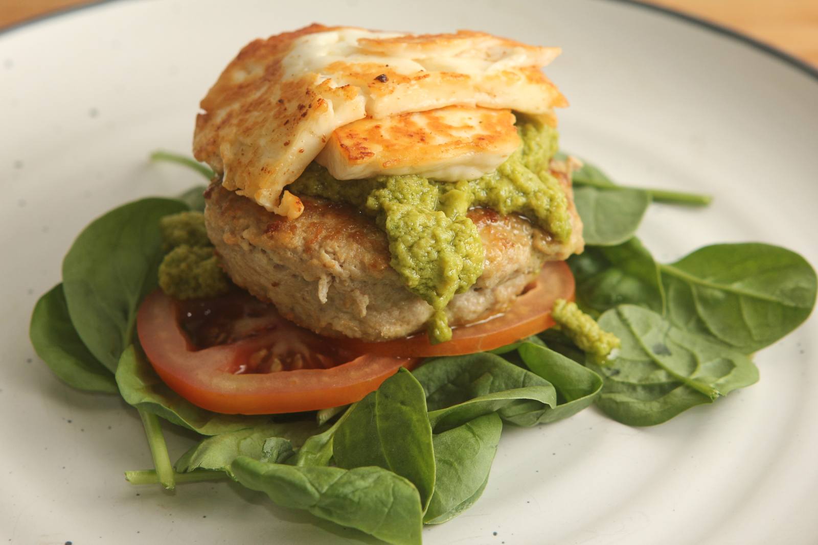 Avocado dressing recipe on a bunless chicken and haloumi burger