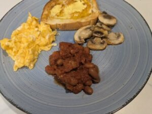 slow cooker baked beans served with scrambled eggs and mushrooms